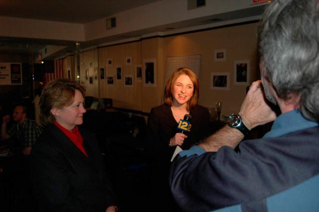 Reporter interviewing Mayor Foster